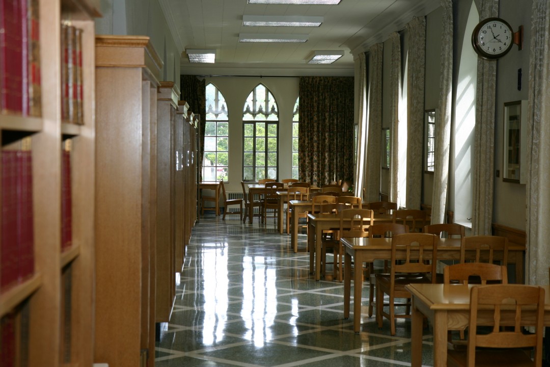 library hallway with many desks